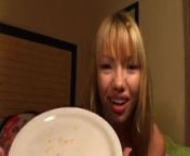 Beautiful Asian girl spits phlegm onto a plate and shows us from catarro