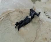 Super Hot Blond Girl In Black Latex Catsuit + High Heels And Sunglasses Bathes In The Mud - Mud Bath from purenudism mud