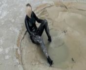Super Hot Blond Girl In Black Latex Catsuit + High Heels And Sunglasses Bathes In The Mud - Mud Bath from mud bath sex